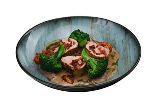 Pork tenderloin with mushroom sauce, broccoli and cherry conf