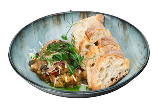 Vegetable stew with sheep cheese and pumpkin seeds